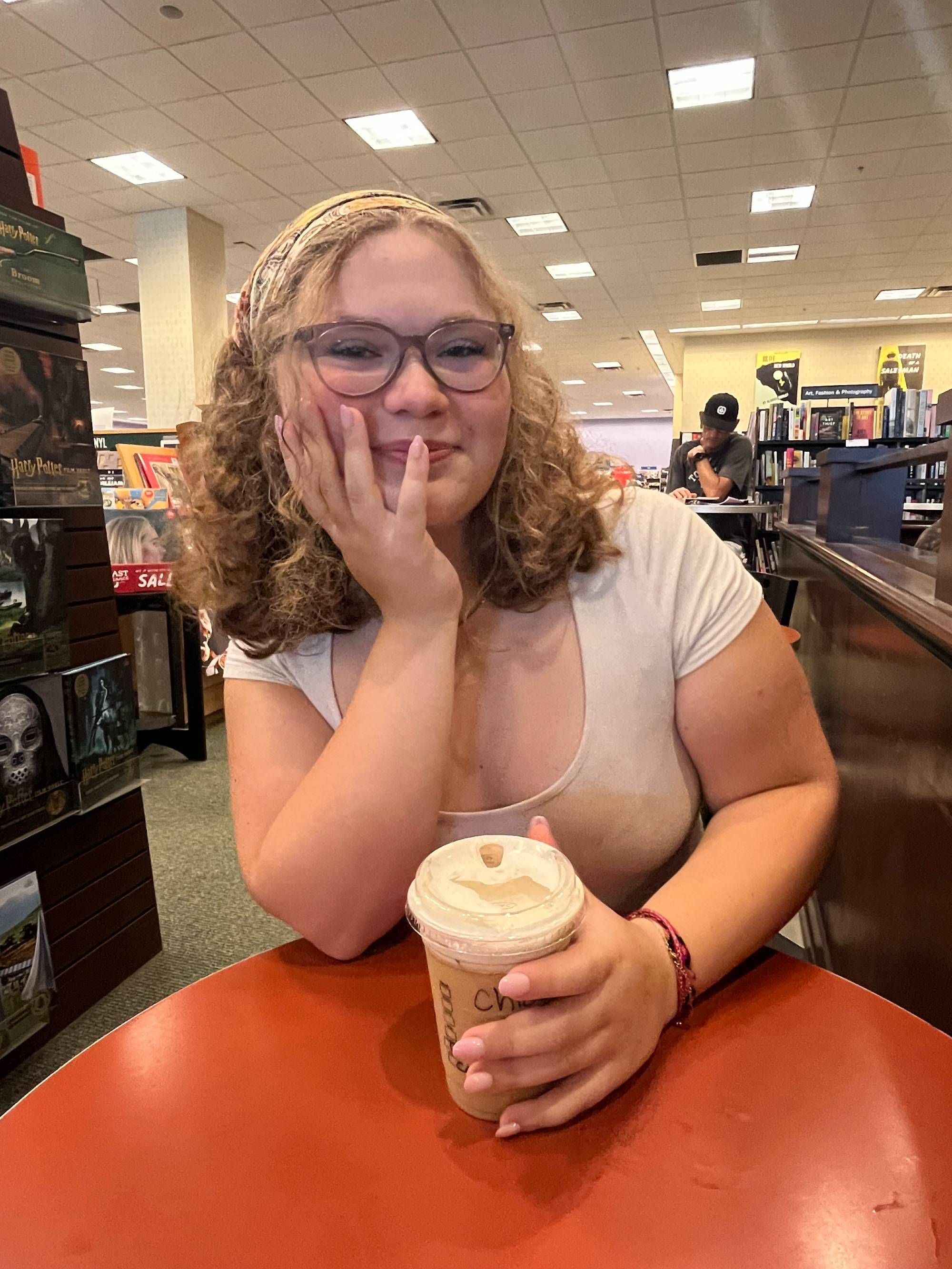 Chloe holding a coffee